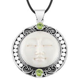 Retail Peridot Quartz pendant with carved bone face handmade in sterling silver with Balinese detailing.